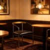 Mid-Century Curved Arm Dining Chair, Chrome Metal Frame with Wood & Leather Armrest, Black PU Cushion