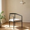 Minimalist Curved Arm Dining Chair, Matte Black Metal Frame with Cream Fabric Cushion